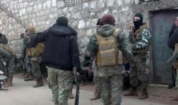 مجموعة من هيئة تحرير الشام خلال مداهمة في إدلب - أرشيف