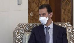 بشار الأسد يضع كمامة