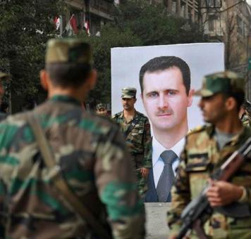 كان العقيد مسؤولاً في أحد سجون استخبارات نظام الأسد بالعاصمة دمشق