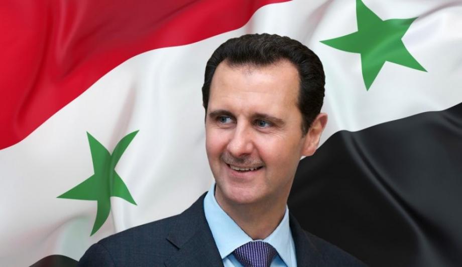 بشار الأسد وعلم النظام في سوريا