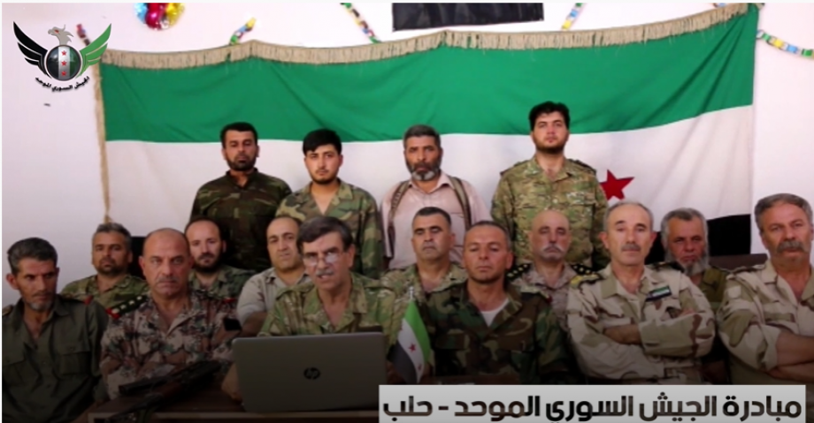 العميد أبو قصي خلال قراءته لبيان الجيش السوري الموحد